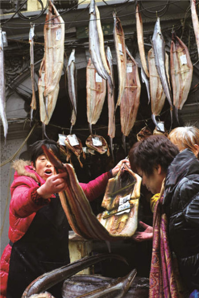 Much effort is taken to prepare for the reunion dinner feast, from handmaking egg dumplings to picking the best eel in the market.