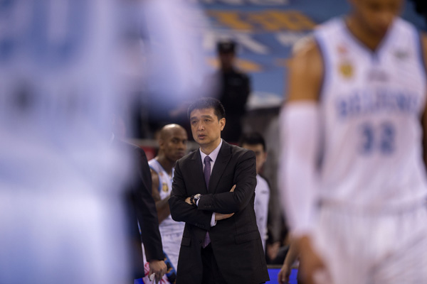 Min Lulei, head coach of Beijing, reacts during Game 4 of the quarterfinal series of the China Basketball Association (CBA) playoffs at the MasterCard Center in Beijing February 21, 2016. (Photo/Xinhua)