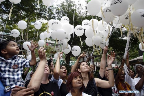 Relatives of people aboard the ill-fated Flight MH370 attend a commemoration event in Malaysian capital Kuala Lumpur March 6, 2016. Flight MH370, a Boeing 777-200ER, disappeared on March 8, 2014, from Kuala Lumpur en route to Beijing with a total of 239 people on board, most of them Chinese nationals. (Photo/Xinhua)