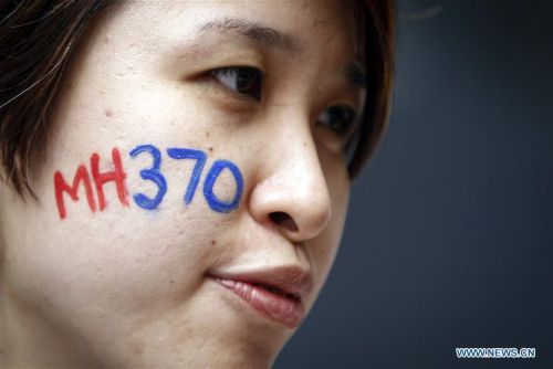 A woman attends a commemoration event for the ill-fated Flight MH370 in Malaysian capital Kuala Lumpur March 6, 2016. Flight MH370, a Boeing 777-200ER, disappeared on March 8, 2014, from Kuala Lumpur en route to Beijing with a total of 239 people on board, most of them Chinese nationals. (Photo/Xinhua)