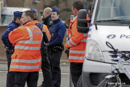  Policemen stand guard outside the Brussels airport in Brussels, Belgium, on March 22, 2016. The death toll has risen to 34 in the deadly blasts in Brussels on Tuesday morning, according to the latest figures. (Xinhua/Zhou Lei)