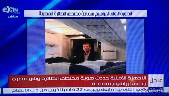 A screenshot taken on March 29, 2016 from anEgyptian television shows the image of the hijacker of the Egyptian passenger plane at Larnaca Airport in Cyprus. Hijacker of EgyptAir passenger plane has been identified as Egyptian, the State TV said Tuesday. Egyptair Company announced a plane that was heading from Alexandria to Cairo has been kidnapped and diverted to Cyprus on Tuesday, state TV reported. (Xinhua)