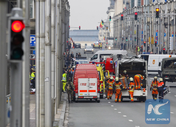 Rescuers and security personnels work outside the Maalbeek railway station in Brussels, Belgium, on March 22, 2016. (Xinhua/Zhou Lei)