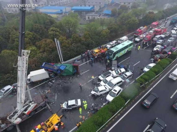 Photo taken on April 2, 2016 shows the accident site where vehicles pile up at the Changzhou section of the highway linking Shanghai and Nanjing, east China's Jiangsu Province. At least two people died and dozens injured in the accident. (Photo/Xinhua)