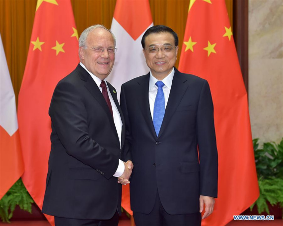 Chinese Premier Li Keqiang meets with Swiss President Johann Schneider-Ammann in Beijing, China, April 7, 2016. (Photo: Xinhua/Li Tao)