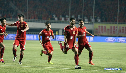 Huang Bowen's opening goal in a World Cup qualifier against Qatar on March 29 helped China secure a berth in Asia's final qualifying round after 15 years. The country aims to become a world leading team by 20150, said a new plan. (Photo by Wu Zhizhao/For China Daily)