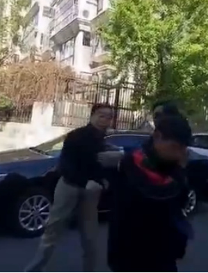 A video grab shows the man slaps the deliveryman. 