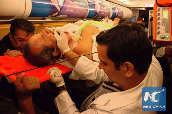 Image taken on April 17, 2016 shows a person seriously injured being transferred on board of a plane towards Quito, in Manta, province of Manabi, Ecuador. (Xinhua/Rafael Rodriguez)