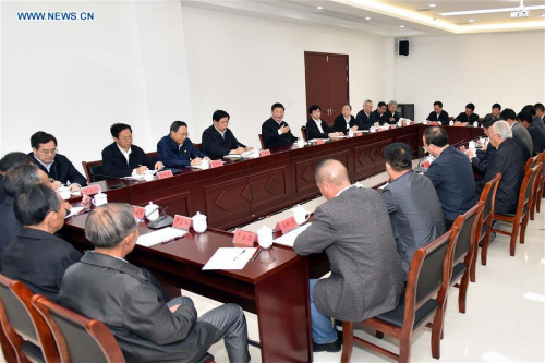 Chinese PresidentXi Jinping(Gesturing) presides over a symposium on rural reform in Xiaogang Village of Fengyang County, east China's Anhui Province, April 25, 2016. (Photo: Xinhua/Li Tao)