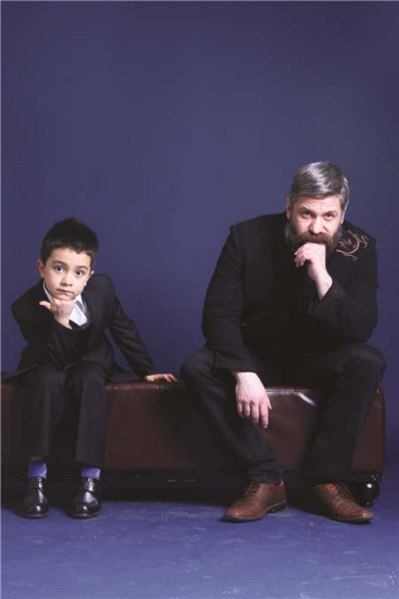 Patrick Kuehnel and his son pose for a family portrait. The German scholar has kept close ties with China, particularly after he married a Chinese woman and started a family about a decade ago. Photos provided to China Daily