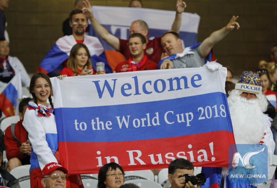 Russian supporters hold a flag reading Welcome to the World Cup 2018 in Russia, as they wait for the start of the Euro 2016 Group B soccer match between Russia and Slovakia at the Pierre Mauroy stadium in Villeneuve d'Ascq, near Lille, France, Wednesday, June 15, 2016. (AP Photo/Frank Augstein)