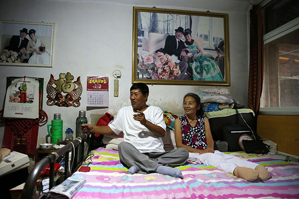 Although left paralyzed, Yang Yufang and his wife Gao Zhihong survived the Tangshan earthquake. WANG ZHUANGFEI/CHINA DAILY