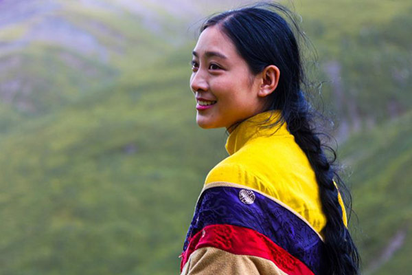 Bright colors, such as yellow, red and blue, are widely used, especially for young women's dresses. (Photo by Han Jiajun/chinadaily.com.cn)