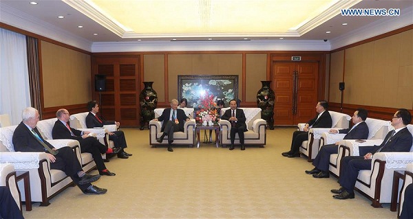 Sun Zhengcai(back R), a member of the Political Bureau of the Communist Party of China (CPC) Central Committee and head of the CPC Chongqing Municipal Committee, meets with guests from France, Britain and New Zealand, who are here to attend The CPC in Dialogue with the World 2016, in southwest China's Chongqing, Oct. 15, 2016. The CPC and political parties from overseas countries completed a two-day in-depth discussion and exchanges on global economic governance in Chongqing on Saturday, and released the Chongqing Initiative as a result of the The CPC in Dialogue with the World 2016. Over 300 delegates from more than 70 political parties and organizations in 50 countries attended the conference. (Xinhua)