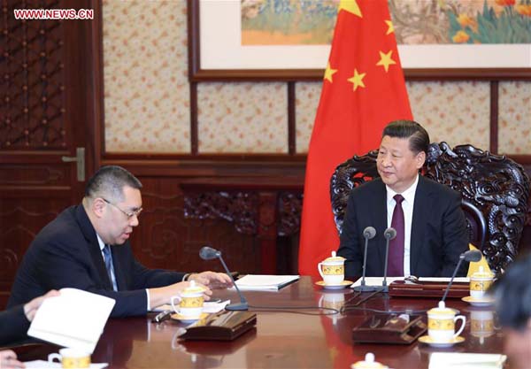 Chinese President Xi Jinping (R) meets with Chui Sai On, chief executive of the Macao Special Administrative Region (SAR) in Beijing, capital of China, Dec. 23, 2016. Chui is in Beijing to report to the central government on his work in 2016. (Xinhua/Ju Peng)