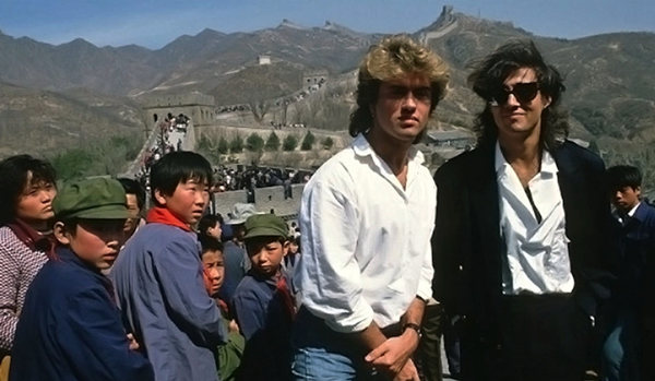 George Michael (left) and Andrew Ridgeley, members of the British band Wham!, visit the Great Wall in April 1985 during their groundbreaking tour of China. Provided to China Daily