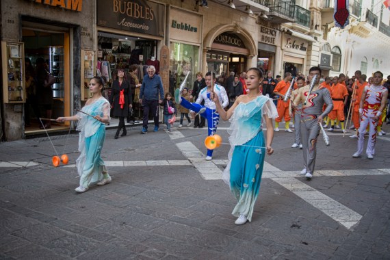 Chinese women play kongzhu, a traditional Chinese game involving a bamboo ball, at a Chinese New Year parade in Malta. (Photo by Anthony Xuereb)