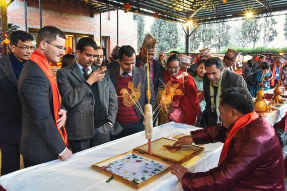 Making sugar paintings - a traditional Chinese art form, attracts crowds at the Chinese embassy in Katmandu, Nepal. (Photo by Zhong Cheng)