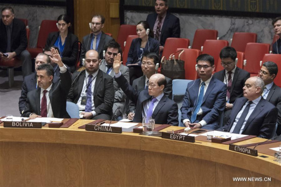 Chinese Ambassador to the UN Liu Jieyi (C, front) votes against a UN Security Council draft resolution aiming to establish a sanctions regime over use of chemicals weapons in Syria at the UN headquarters in New York, on Feb. 28, 2017. (Xinhua/Li Muzi)