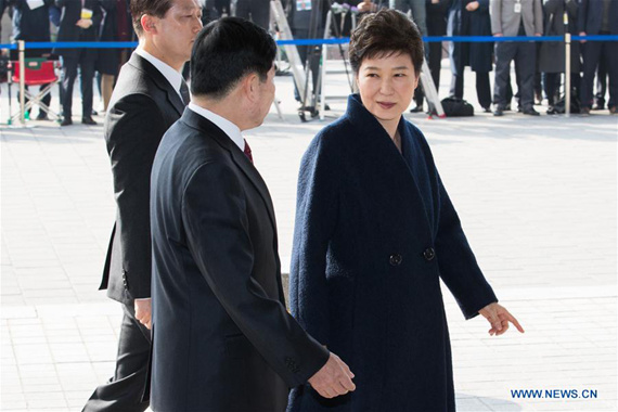 Ousted South Korean President Park Geun-hye (R) arrives at the prosecutors' office in Seoul, South Korea, March 21, 2017. Park Geun-hye appeared Tuesday in the prosecutors' office to be questioned over an corruption scandal that led to her impeachment earlier this month. (Xinhua/Lee Sang-ho)