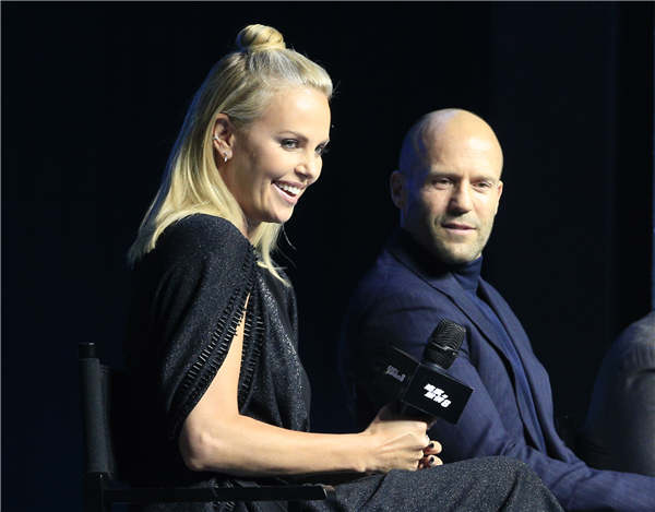 Charlize Theron and Jason Statham come to Beijing to promote The Fate of the Furious, the eighth installment in the car-racing cinematic franchise The Fast and the Furious, which is to be premiered simultaneously in China and the United States. (Photo by Jiang Dong/China Daily)