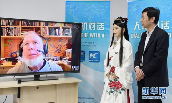 Kevin Kelly (L), Jia Jia (M), and the robot's development team leader, Professor Chen Xiaoping (R) in Hefei, Anhui Province, on April 24, 2017. (Xinhua Photo)