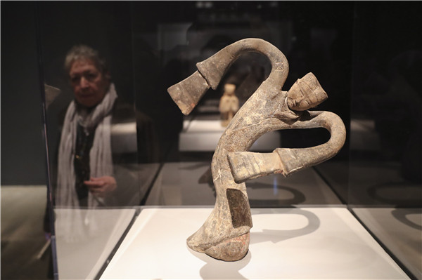 A terracotta figurine is on display at a media preview of the exhibition on March 27. (Photo/Xinhua)