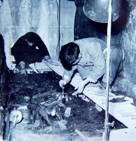 Archaeologists clearing the coffins at Dingling Mausoleum. (Photo provided to China Daily)