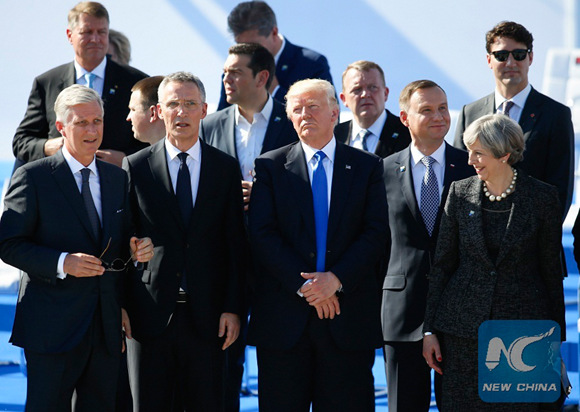 King Philippe of Belgium, NATO Secretary General Jens Stoltenberg, U.S. President Donald Trump, British Prime Minister Theresa May (from L to R, front) and other NATO member states leaders watch air show at the handover ceremony of the new NATO headquarters during a one-day NATO Summit, in Brussels, Belgium, May 25, 2017. (Xinhua/Ye Pingfan)