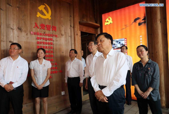 Liu Yunshan (R front), a member of the Standing Committee of the Political Bureau of the Communist Party of China (CPC) Central Committee, visits Shizhen Village to learn more about Liao Junbo, a late official who had served in Fujian, in Zhenghe County, southeast China's Fujian Province, June 9, 2017. 