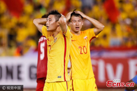 China's Wu Lei, No. 7 and Yu Hanchao, No 20, look dejected during the 2018 Russia World Cup qualifier against Syria at Hang Jebat Stadium, Malacca City, Malaysia on June 13, 2017. China's flickering hope to reach the 2018 World Cup was dimmed after they conceded a last minute goal and tied Syria 2-2 in Asian qualifiers here on Tuesday. (Photo/VCG)