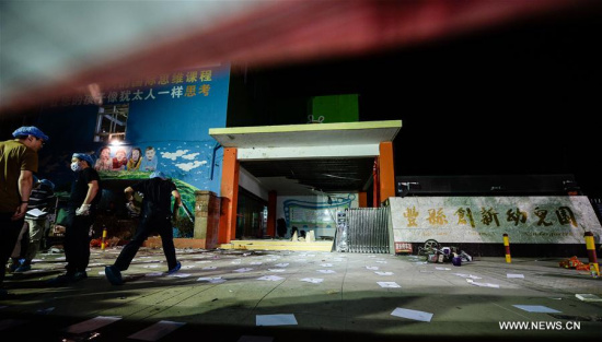 Forensic experts work at the site of the explosion near a kindergarten in Fengxian County in east China's Jiangsu Province, June 16, 2017. (Xinhua/Li Xiang)