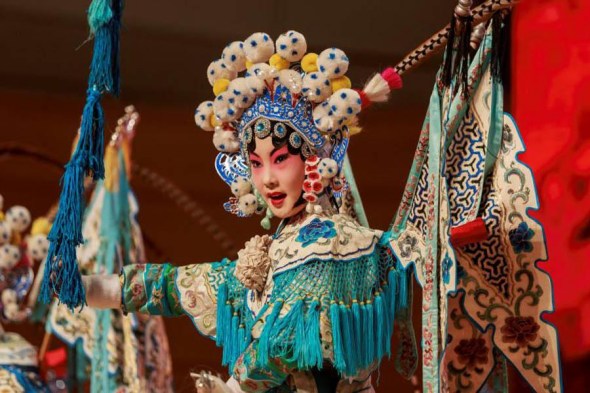 Students perform Peking Opera at the Qingdao Grand Theater in Qingdao, Shandong Province, June 8, 2017. (Photo/China Daily)