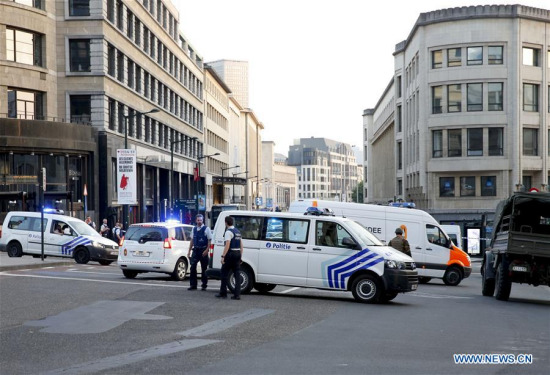 Belgian police officers stand guard in a cordoned off area outside the Brussels Central Station after a small explosion in Brussels, Belgium, on June 20, 2017. (Xinhua/Ye Pingfan)