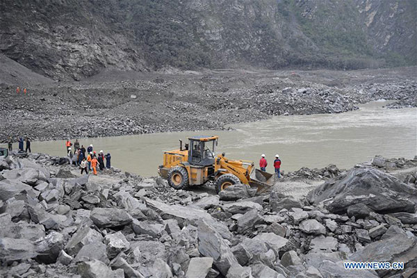 Rescuers work at the accident site after a landslide occurred in Xinmo village of Maoxian county, Tibetan and Qiang autonomous prefecture of Aba, Southwest China's Sichuan province, June 24, 2017. (Photo/Xinhua)