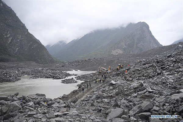 Rescuers work at the accident site after a landslide occurred in Xinmo village of Maoxian county, Tibetan and Qiang autonomous prefecture of Aba, Southwest China's Sichuan province, June 24, 2017. (Photo/Xinhua)