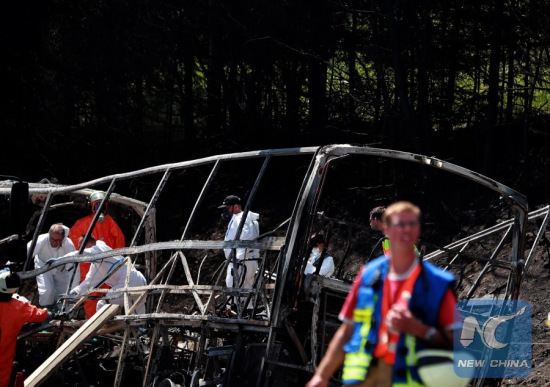 Rescuers work in the site of the bus-truck collision accident in Bavaria, Germany, on July 3, 2017.German police confirmed on Monday on the Twitter account that many people are dead in a tour bus-truck collision accident in southern Germany. (Xinhua/Luo Huanhuan)