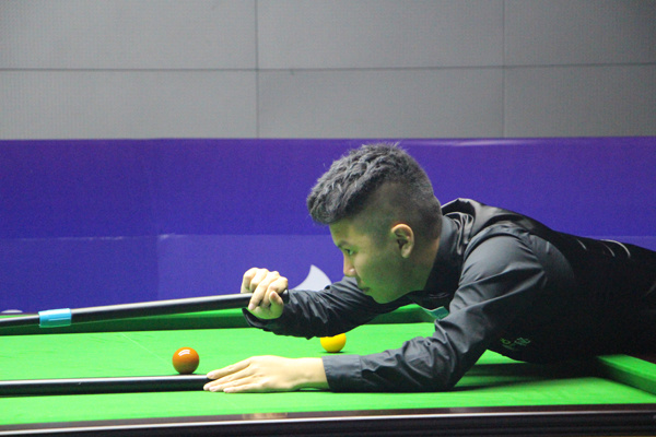 Zhou Yuelong concentrates on his next shot during China B's quarterfinal against Belgium in the 2017 Little Swan World Cup in Wuxi, Jiangsu province on July 8. (Photo provided to China Daily)