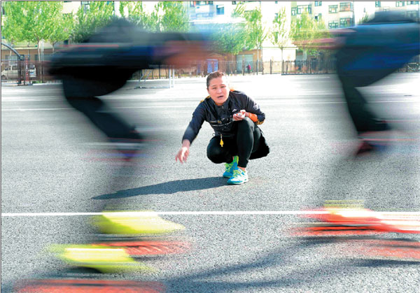 Zhang Jie coaches the Special Olympics short-track speedskating team she founded in Qitaihe, Heilongjiang province.Photos By Wang Kai / Xinhua