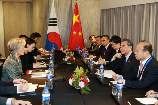 Chinese Foreign Minister Wang Yi (2nd R) meets with South Korean Foreign Minister Kang Kyung-wha (1st L) on the sidelines of a series of ASEAN foreign ministers' meetings in Manila, the Philippines, Aug. 6, 2017. (Xinhua/Rouelle Umali)