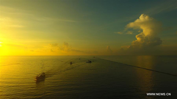 Fishing boats return to the fishing port in the morning in Qionghai City, south China's Hainan Province, Aug. 17, 2017. The fishing season of the South China Sea started on Wednesday after this summer's fishing ban. (Xinhua/Meng Zhongde)