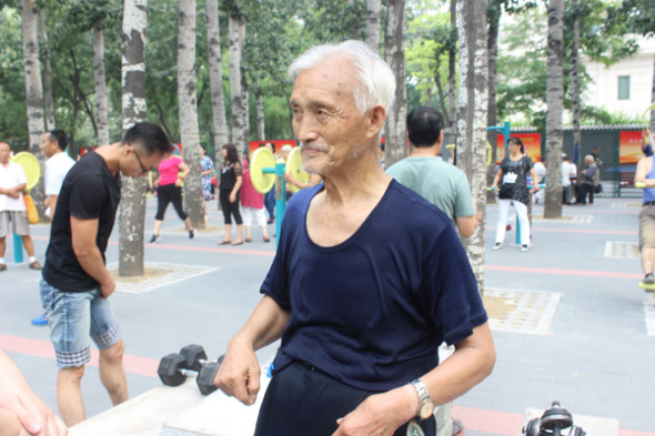 Guo does physical exercise in the Ritan Park, Beijing. [Photo by Nanda Lal Tiwari