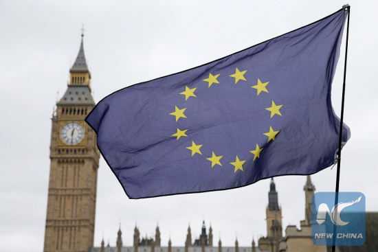 An EU flag is seen outside the the Houses of Parliament in London, Britain on March 29, 2017. (Xinhua file photo/Tim Ireland)