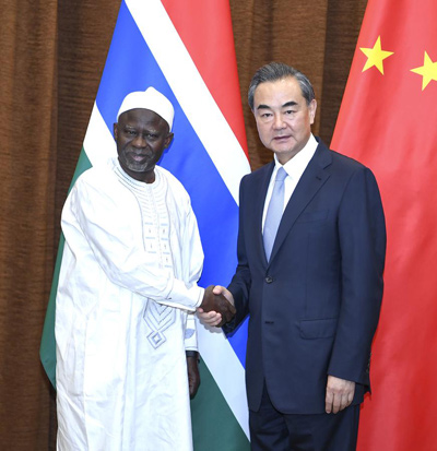 Chinese Foreign Minister Wang Yi meets with his Gambian counterpart Ousainou Darboe in Beijing on Tuesday. (Photo/Xinhua)