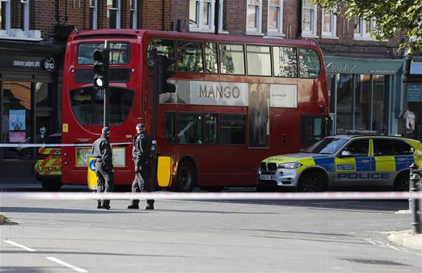 Police stand guard near the Parsons Green tube station in London, Britain, on Sept. 15, 2017. An explosion in a subway station in west London is being treated as terrorist incident, British counter terrorism sources said Friday. (Xinhua/Han Yan)