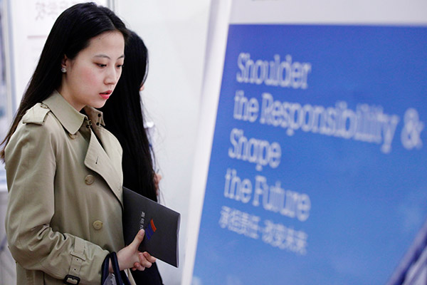 Graduates returning home often have to attend job fairs to find work because the market is getting tight. (Photo provided to China Daily)