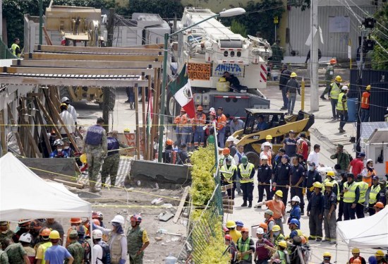 Rescuers search for survivors at the Enrique Rebsamen school after an earthquake in Mexico City, capital of Mexico, on Sept. 20, 2017. (Xinhua/David de la Paz)