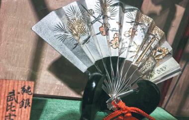 A silver-boned folding fan on sale in the shop. Liang Fengxin/China Daily