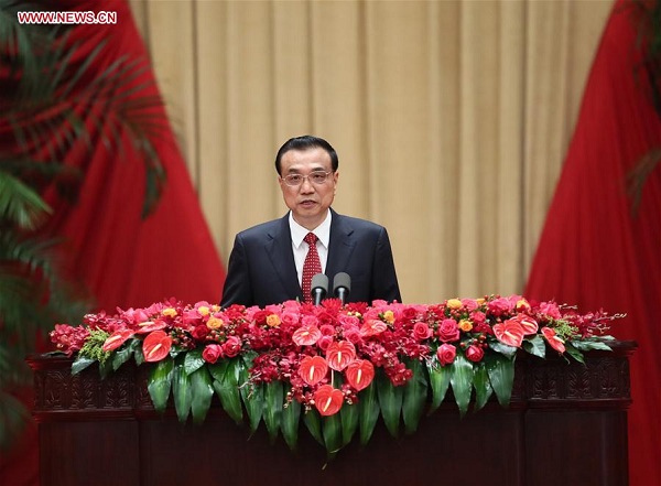 Chinese Premier Li Keqiang addresses a reception held by the State Council to celebrate the 68th anniversary of the founding of the People's Republic of China, in Beijing, capital of China, Sept. 30, 2017. (Xinhua/Lan Hongguang)