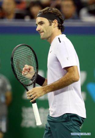 Switzerland's Roger Federer reacts during the men's singles second round match against Argentina's Diego Schwartzman at 2017 ATP Shanghai Rolex Masters in Shanghai, east China, Oct. 11, 2017. (Xinhua/Fan Jun)